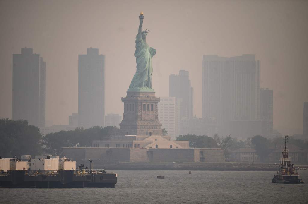 The Statue of Liberty from the Staten Island Ferry during heavy smog in New York City on June 6, 2023.